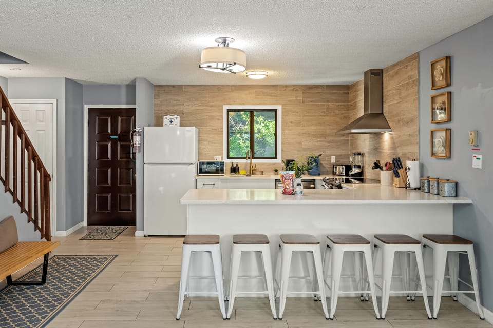 Modern kitchen with barstool seating.