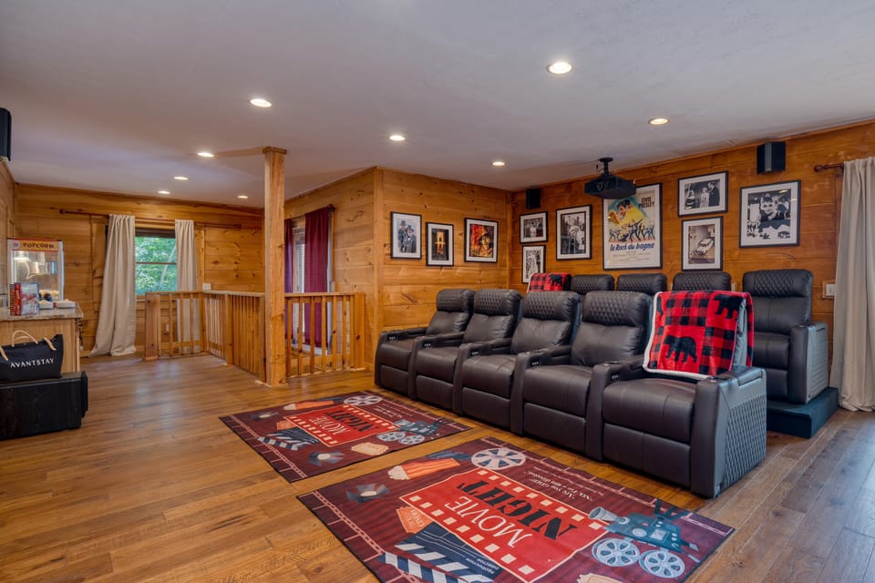 Home theater with plush seating and a large screen for the ultimate viewing experience