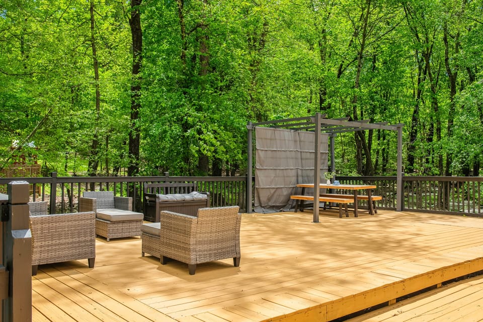 Enjoy the spacious deck featuring a gazebo, comfortable seating and an outdoor dining area.