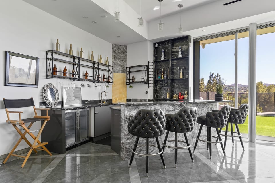 Raise a glass in the stylish bar area — perfect for cocktails and conversation.
