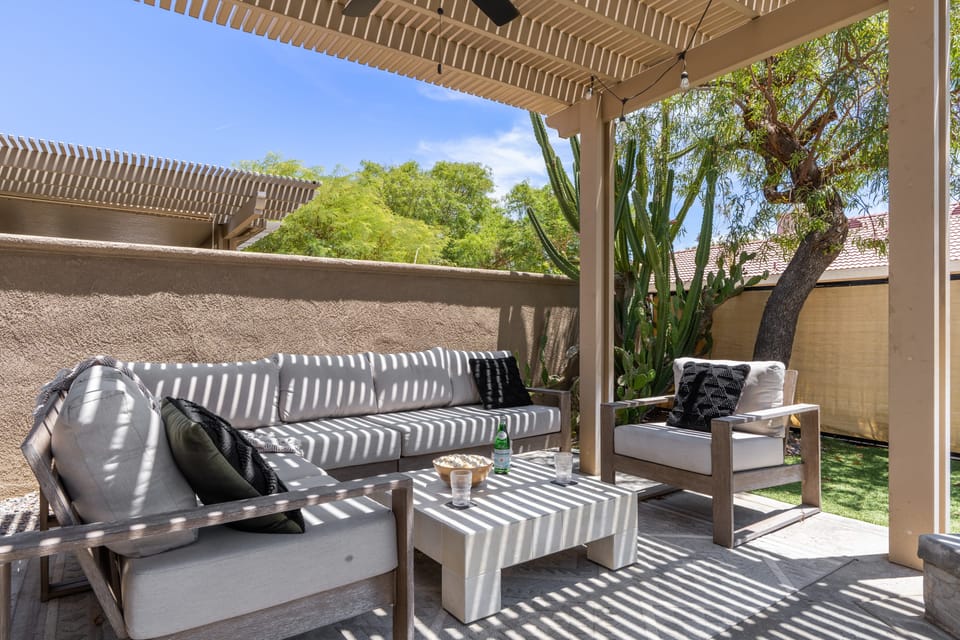 Lounge under the shady pergola.