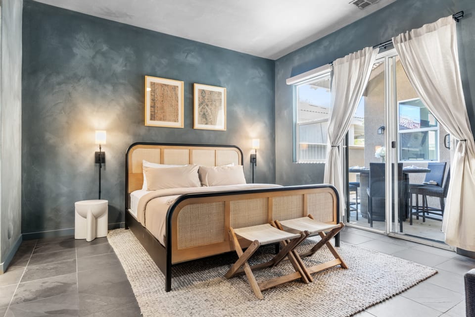 The primary bedroom features a king bed, smart TV, and an ensuite bathroom.