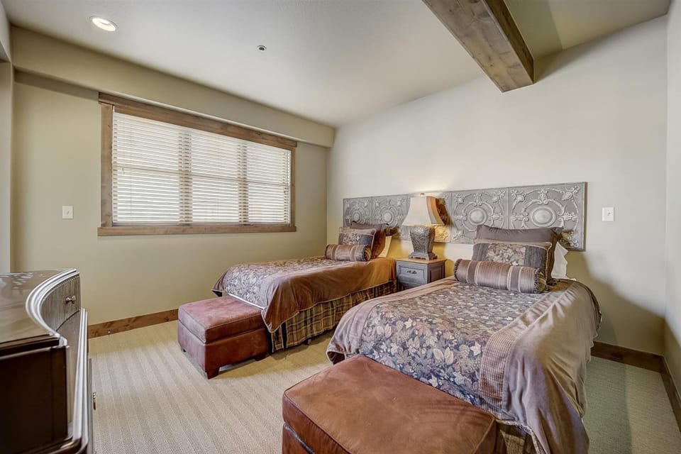 Bedroom 2 features two twin beds.