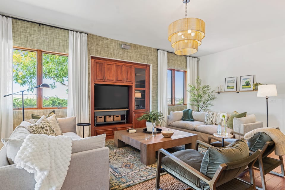 Bright living room with large windows and views.