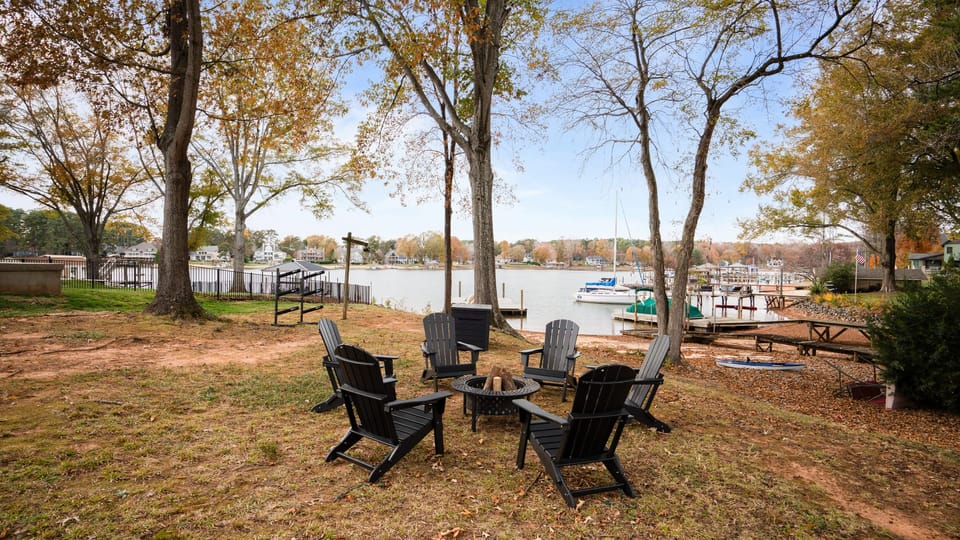 Lakeside firepit with Adirondack seating for sunset gatherings.