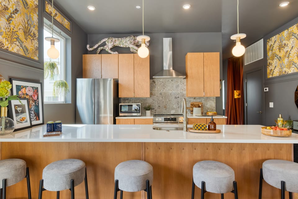 Sleek, modern kitchen with barstool seating.