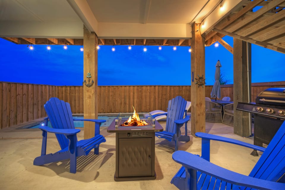 Gather around the fire pit by the pool. (The Madison)