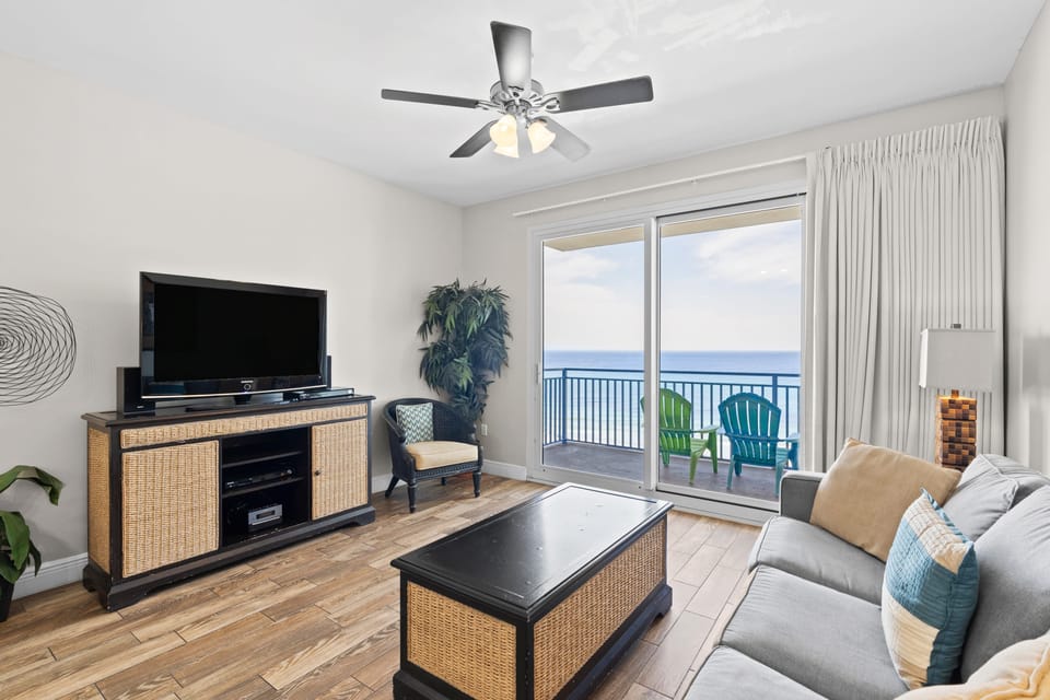 Bright living room with a Gulf view balcony.