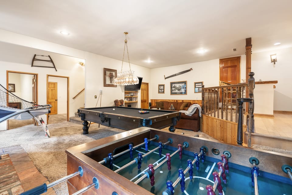 Perfect for a rainy day or a fun night in. This game room is an entertainer's dream, complete with a cozy lounge area.