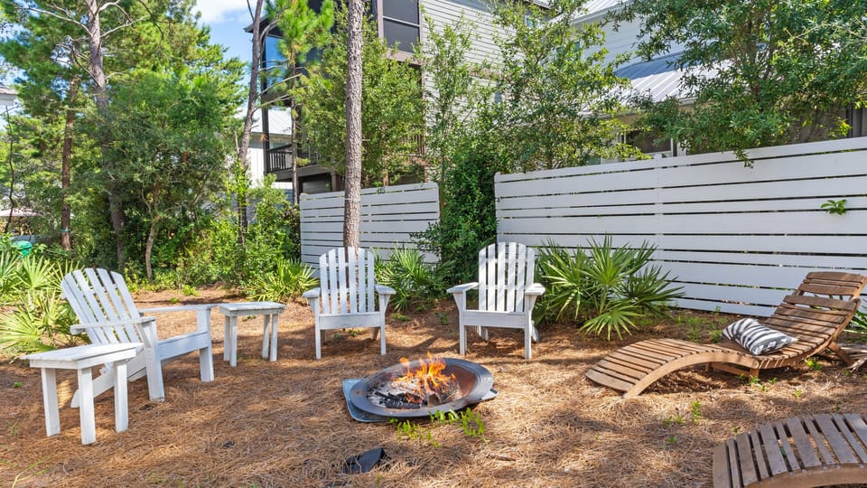 Backyard fire pit with seating for gatherings.