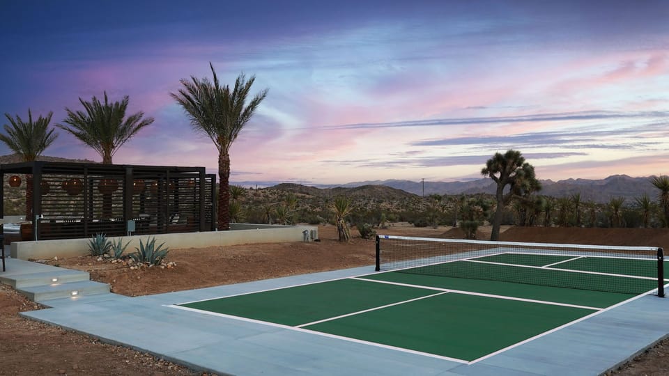 Chef's kitchen with stainless steel appliances, and 12' marble island with seating for 5.