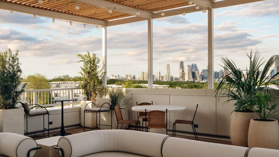Shared rooftop terrace with skyline views.