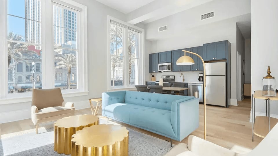 Bright and airy living room with plush seating and a TV to keep you entertained.
