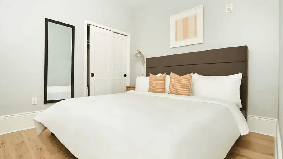 Bedroom 1 features a queen bed.