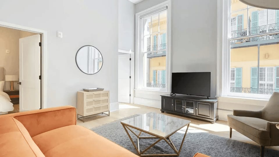 Living room with plush seating and a TV.