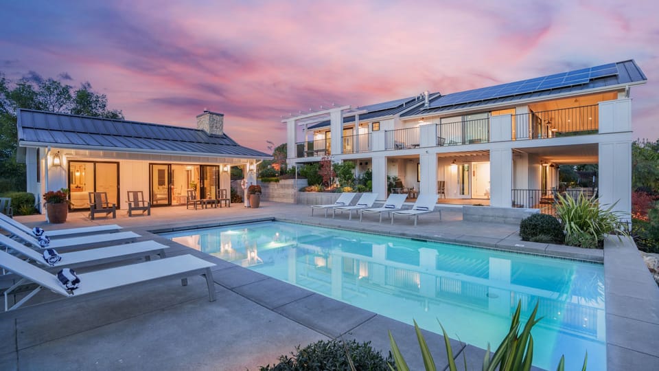 Unwind by the pool with a stunning sunset view.