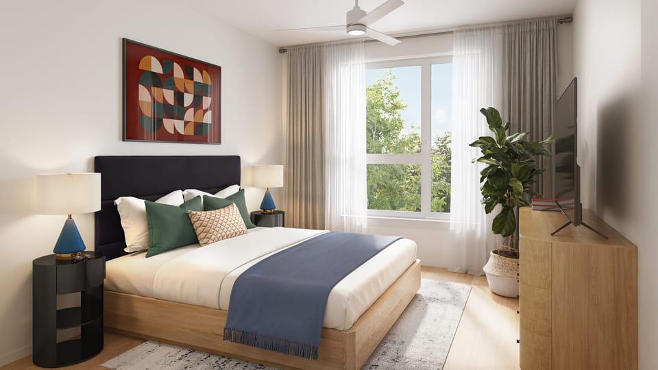 1 Bedroom Suite: Modern bedroom with ceiling fan, TV, and modern decor.