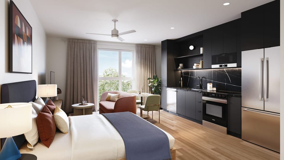 Modern studio featuring a ceiling fan, TV, and contemporary decor. (The Code -132)