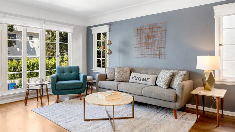 Unwind in the living room with plush seating and easy access to the outdoors.
