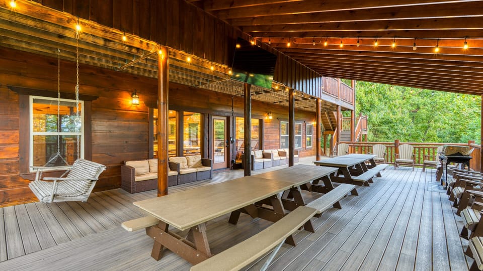 This expansive covered deck is ready for every family reunion, group dinner, or quiet evening swing.