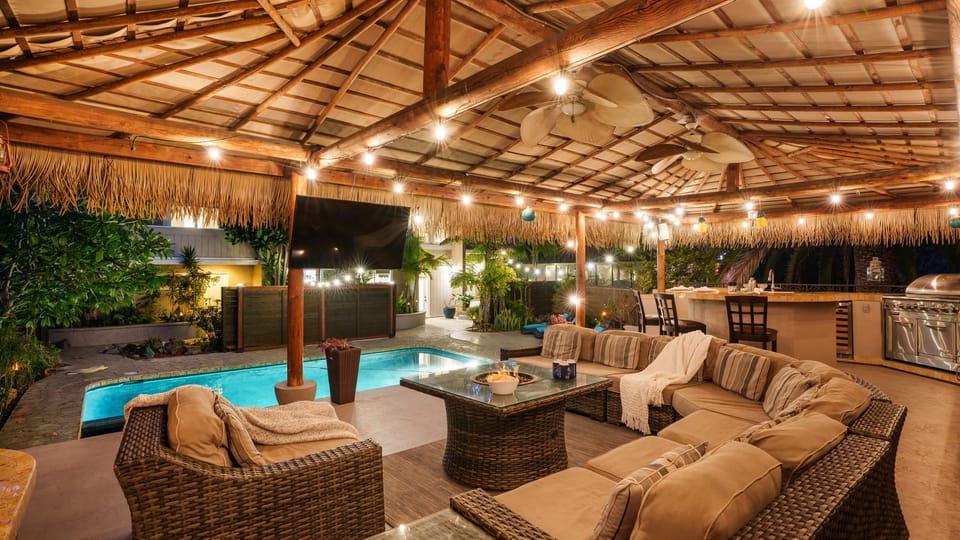 Chill out by the tiki lounge while enjoying pool views.