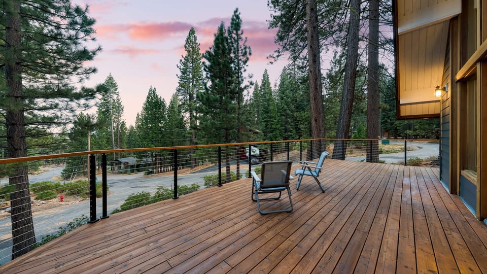 Spacious wraparound deck overlooking the pines—ideal for morning coffee or golden-hour relaxation.