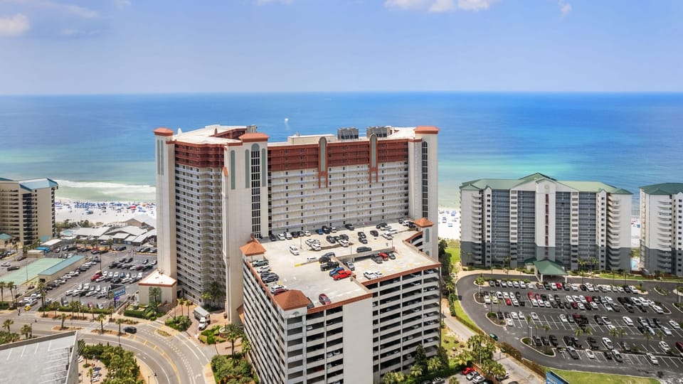 Aerial view of the resort complex overlooking sugar-white sands and the sparkling Gulf Coast.
