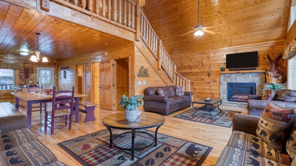 View of the living room and open loft area above.