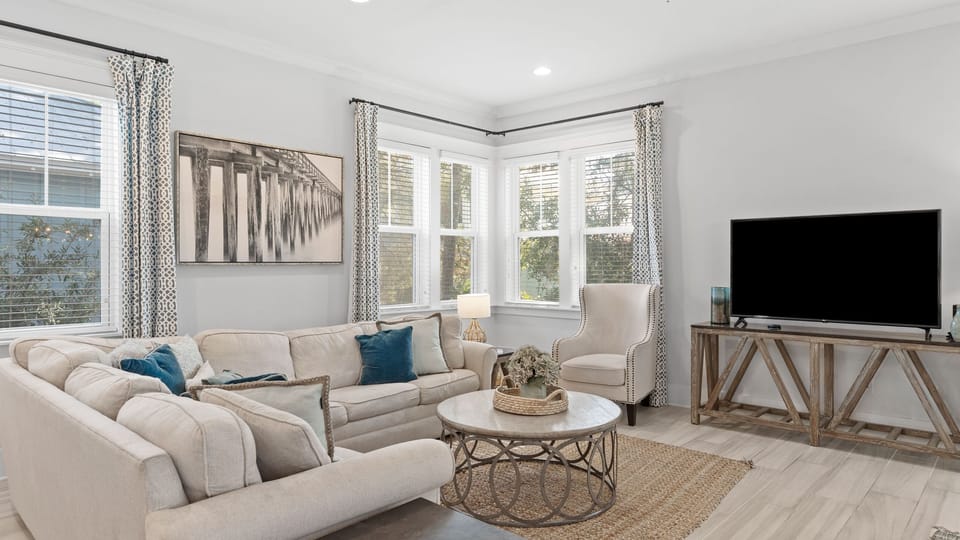 Bright and cozy living area with coastal decor.