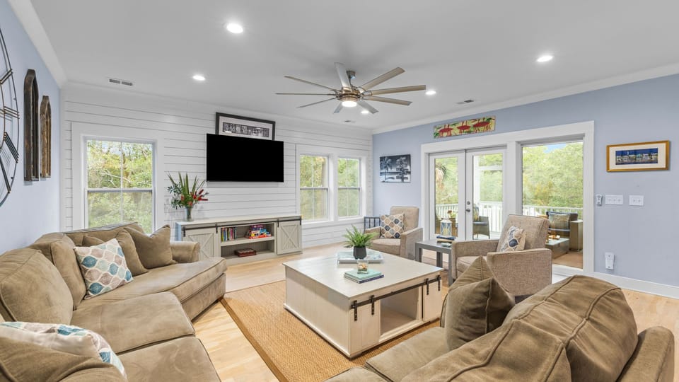 Bright and airy main living room with sectional sofa and coastal decor.