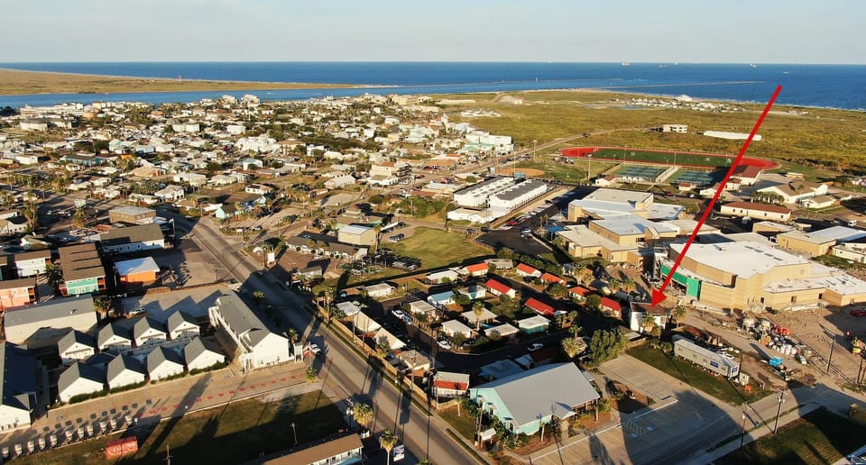 Get a bird’s-eye view of the neighborhood, with an arrow highlighting the perfect spot where your getaway awaits.