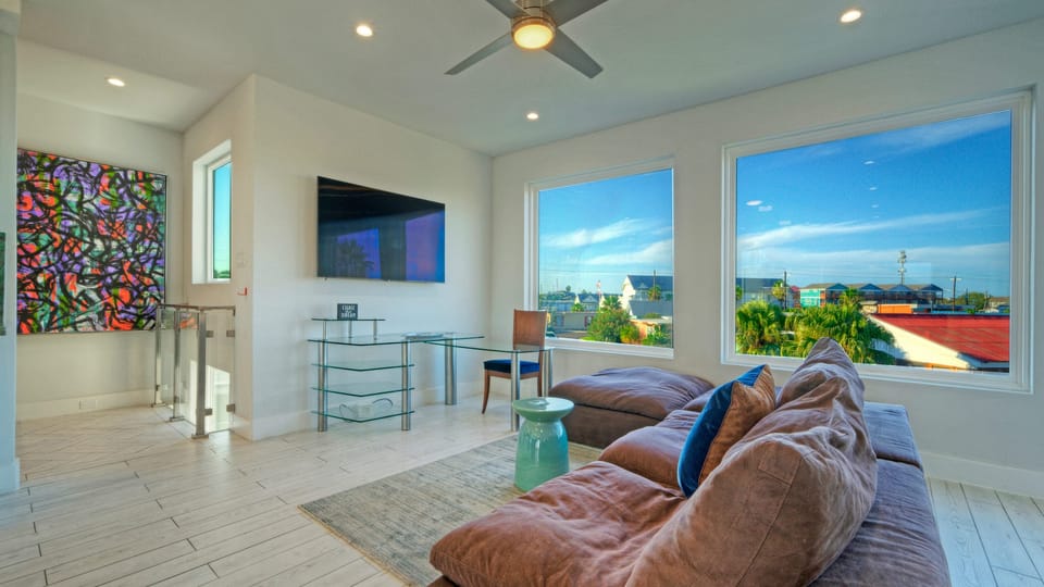 Bright and airy living room with open views and a TV to keep you entertained.