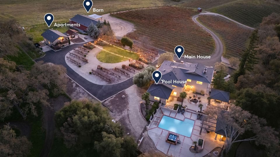 High-angle dusk shot of the entire gated property.
