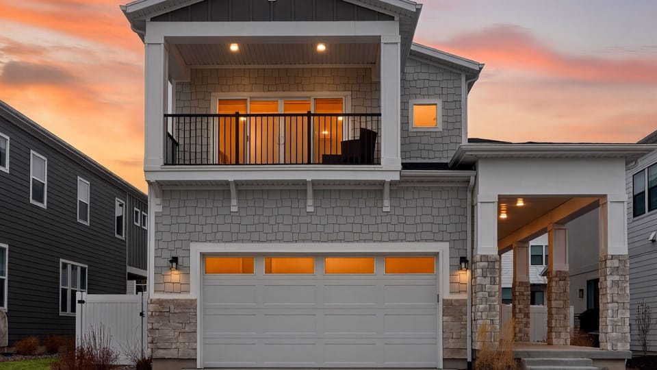 Modern Park City getaway with sunset glow, private balcony, and covered entry—your mountain basecamp for year-round adventure.