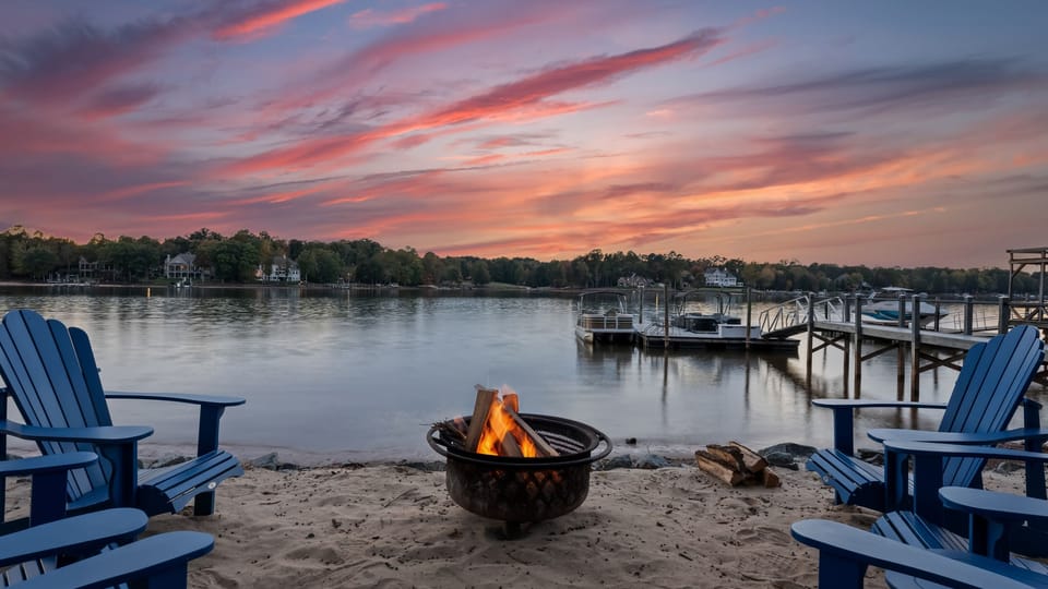 Lakefront fire pit area invites you to unwind.