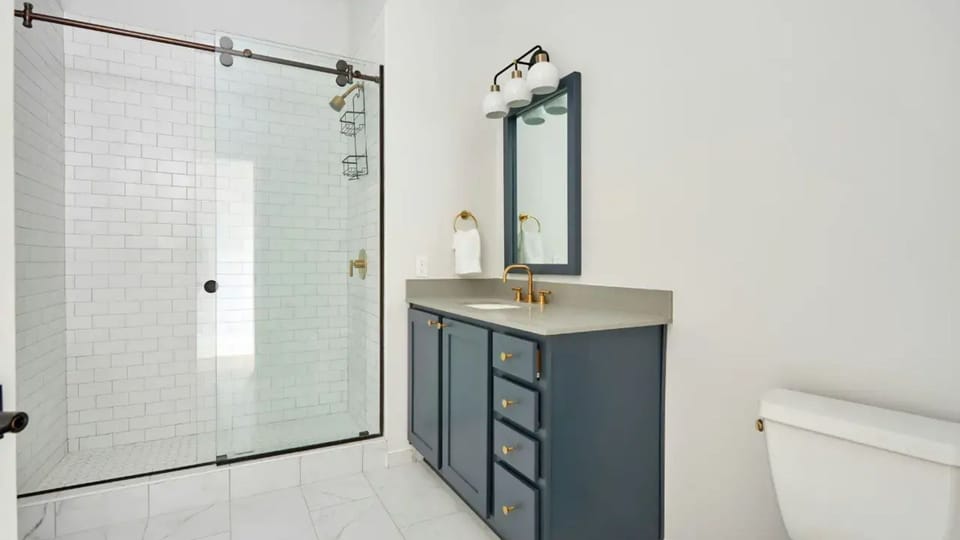 Full bathroom features a shower.