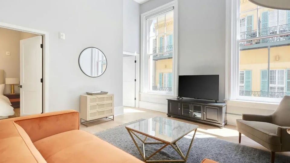 Living room with plush seating and a TV.