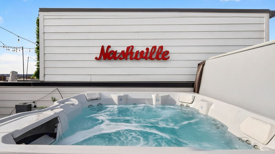 Unwind in the rooftop hot tub with city views.