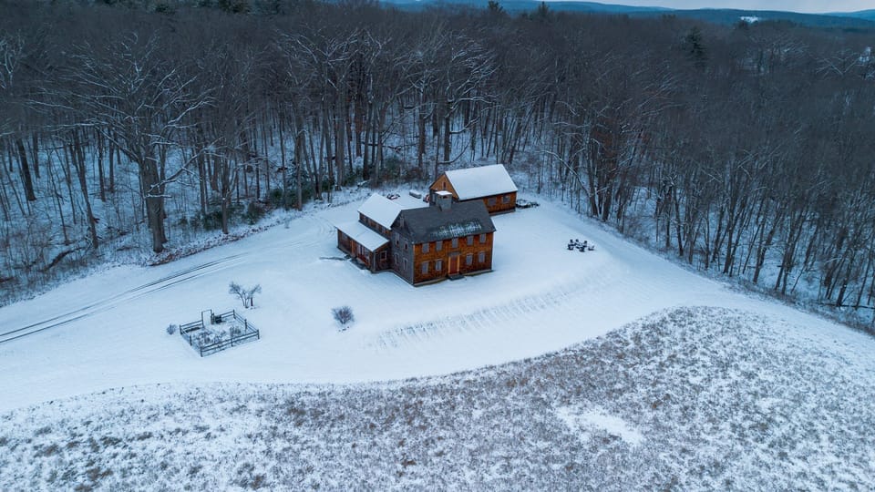 Cozy Berkshires retreat framed by a serene winter setting.