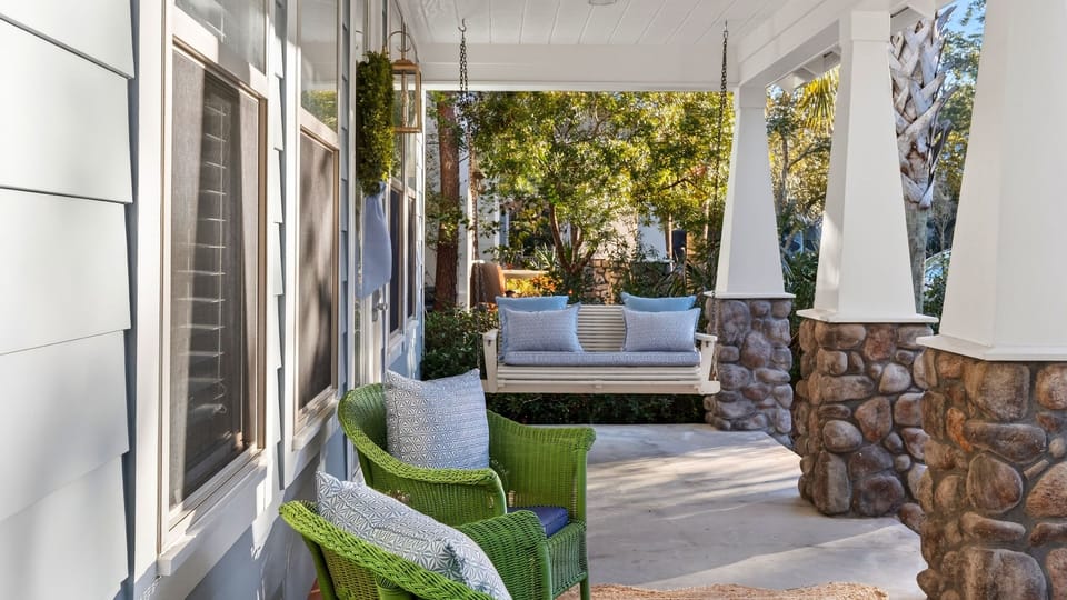 Front porch featuring a cozy hanging swing.