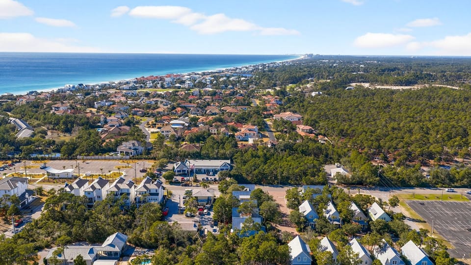 Panoramic aerial view showing the neighborhood's layout near the coastline.