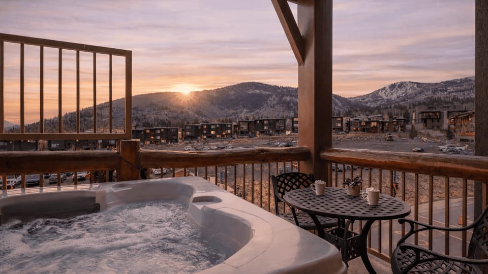 Private balcony hot tub with sweeping mountain views—perfect for après-ski soaks or sunset relaxation.