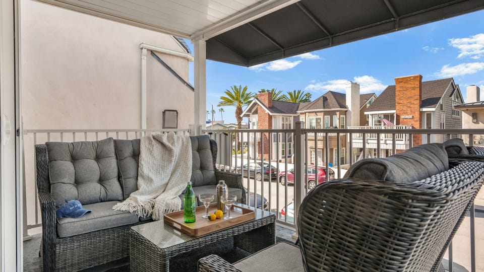 Private upper-level balcony with comfortable seating, perfect for morning coffee or evening wind-down.