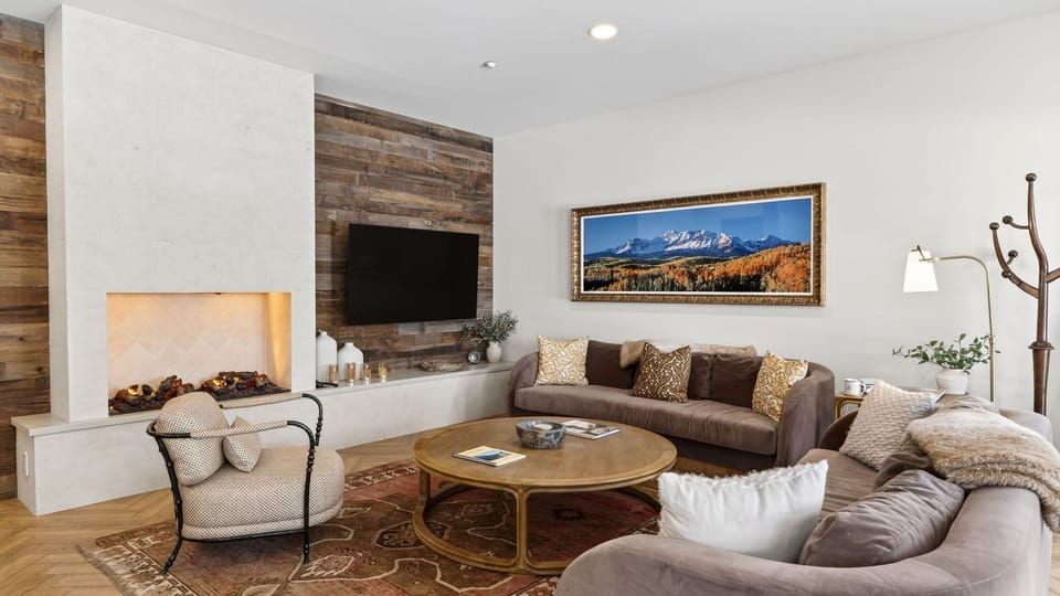 Bright, fully equipped kitchen with a spacious island and bar seating—perfect for cooking, gathering, and après-ski snacks.