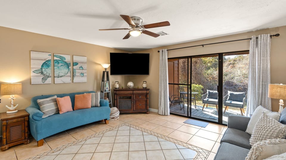 Relax in your sun-drenched coastal retreat—just steps away from your private patio.