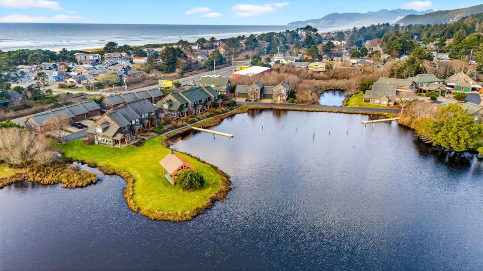 Aerial view of the coastal community, lake, and nearby shoreline.