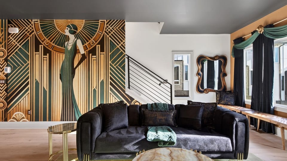 Stylish living room with plush seating, statement chandelier, and open-concept layout.