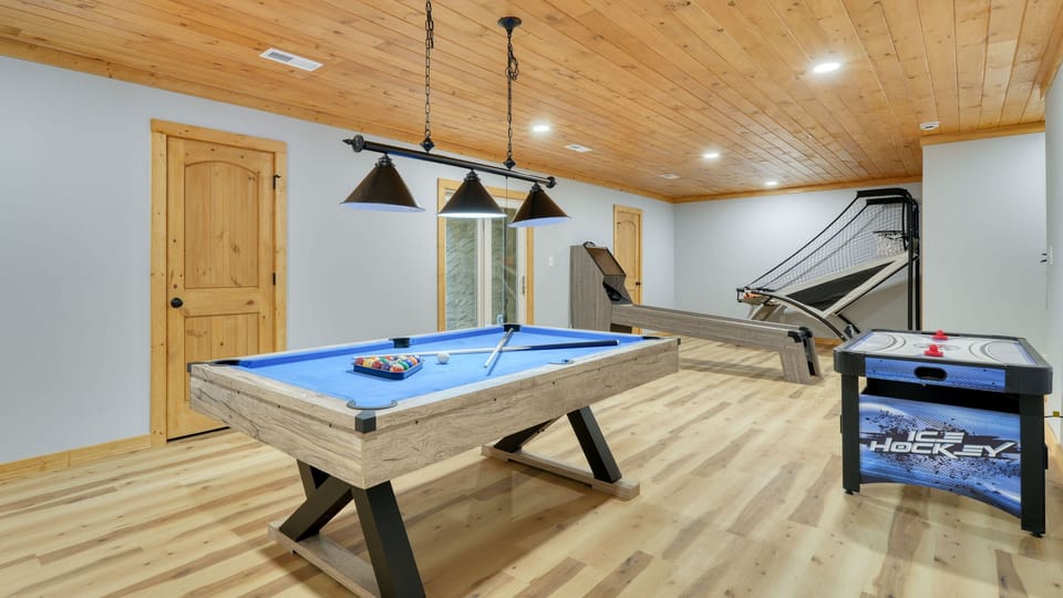 Game room featuring a pool table, basketball hoop, and air hockey table. (Perfect Too)