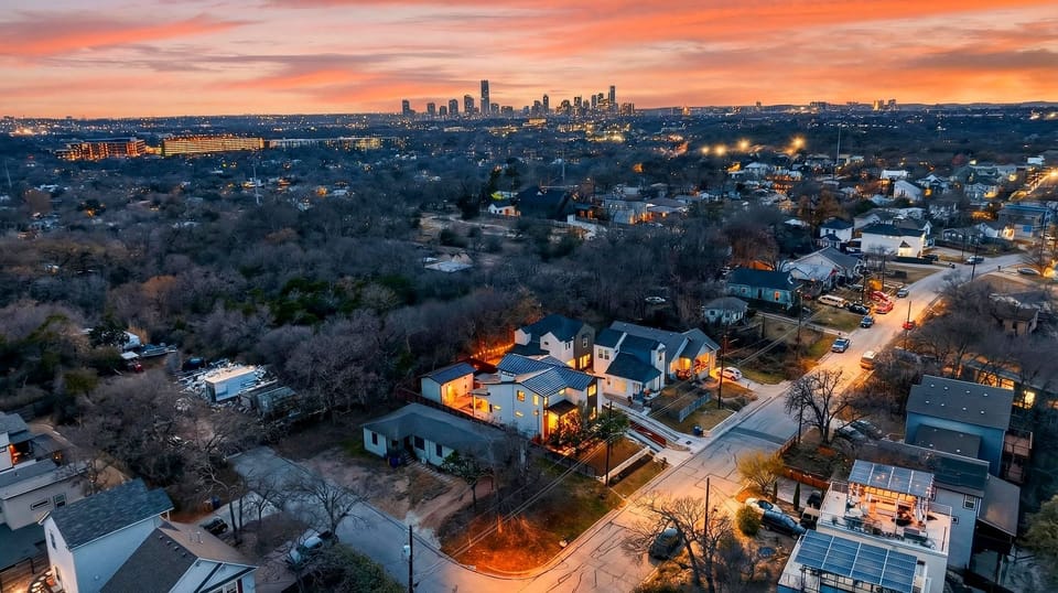 Open-concept living and dining area featuring a modern fireplace, stylish seating, and abundant natural light.