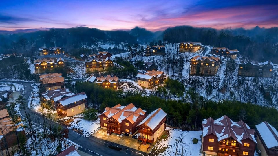 Aerial view of the mountain lodge community set among snow-dusted peaks and forested hillsides—offering a scenic Smoky Mountain backdrop and peaceful surroundings.
